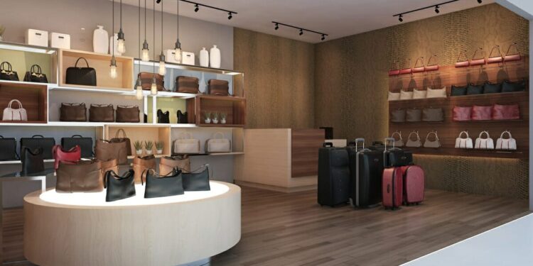 Interior of a retail space featuring various handbags and luggage on display.
