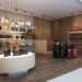 Interior of a retail space featuring various handbags and luggage on display.