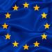 European Union flag featuring a blue background with a circle of twelve yellow stars.