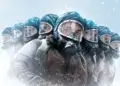 A group of individuals wearing gas masks and protective clothing in a snowy environment.