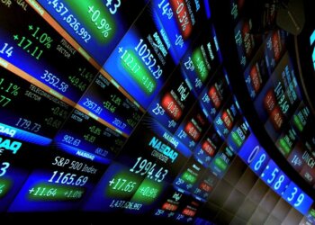 Digital display of NASDAQ stock market data showing various stock prices and indices.