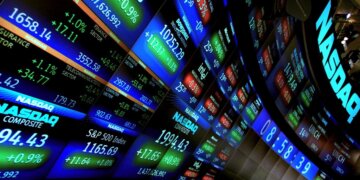 Digital display of NASDAQ stock market data showing various stock prices and indices.