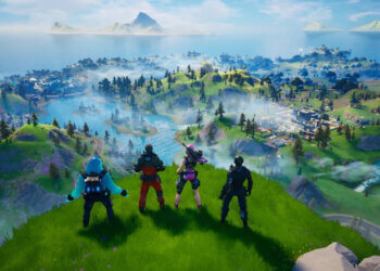 Four characters from Fortnite standing on a grassy hill overlooking a vibrant game landscape.