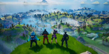 Four characters from Fortnite standing on a grassy hill overlooking a vibrant game landscape.