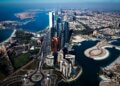 Aerial view of the Abu Dhabi skyline featuring modern skyscrapers and coastal areas.