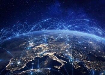 A digital representation of global internet connectivity over a nighttime view of Earth.