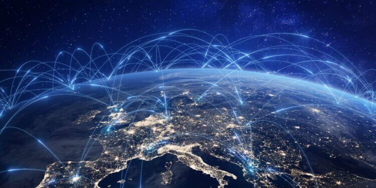 A digital representation of global internet connectivity over a nighttime view of Earth.