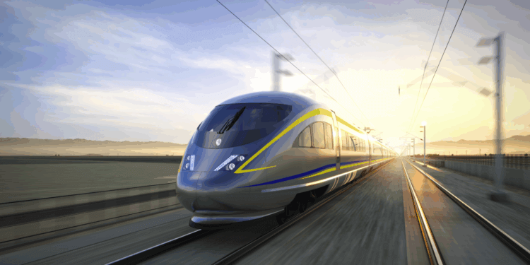 A high-speed train traveling on tracks with a blurred background of landscape and sunrise.