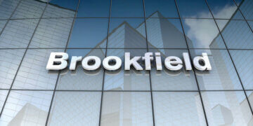 Signage of Brookfield Asset Management displayed on a glass building exterior.