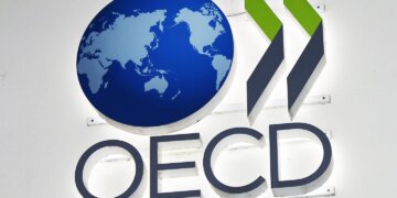 OECD logo featuring a globe and stylized arrows in green and gray colors.