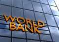 Sign displaying the words 'World Bank' on a glass building facade.