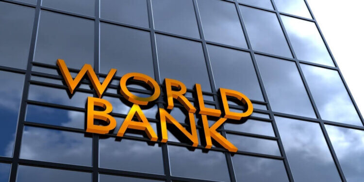 Sign displaying the words 'World Bank' on a glass building facade.
