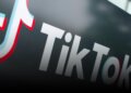 Close-up of the TikTok logo featuring a stylized musical note in red and blue colors.