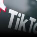 Close-up of the TikTok logo featuring a stylized musical note in red and blue colors.
