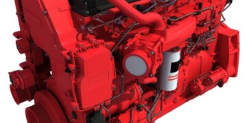 A red diesel engine with various components and piping visible from multiple angles.