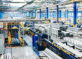 Interior view of an industrial manufacturing facility with machinery and equipment.