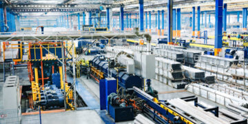 Interior view of an industrial manufacturing facility with machinery and equipment.