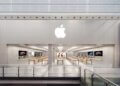 Exterior view of the Apple Store at Manchester Arndale with the Apple logo displayed prominently.