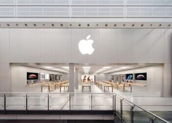 Exterior view of the Apple Store at Manchester Arndale with the Apple logo displayed prominently.