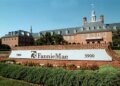 Fannie Mae headquarters building with a prominent sign and landscaped area in front.