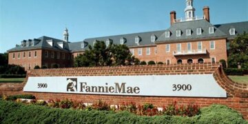 Fannie Mae headquarters building with a prominent sign and landscaped area in front.